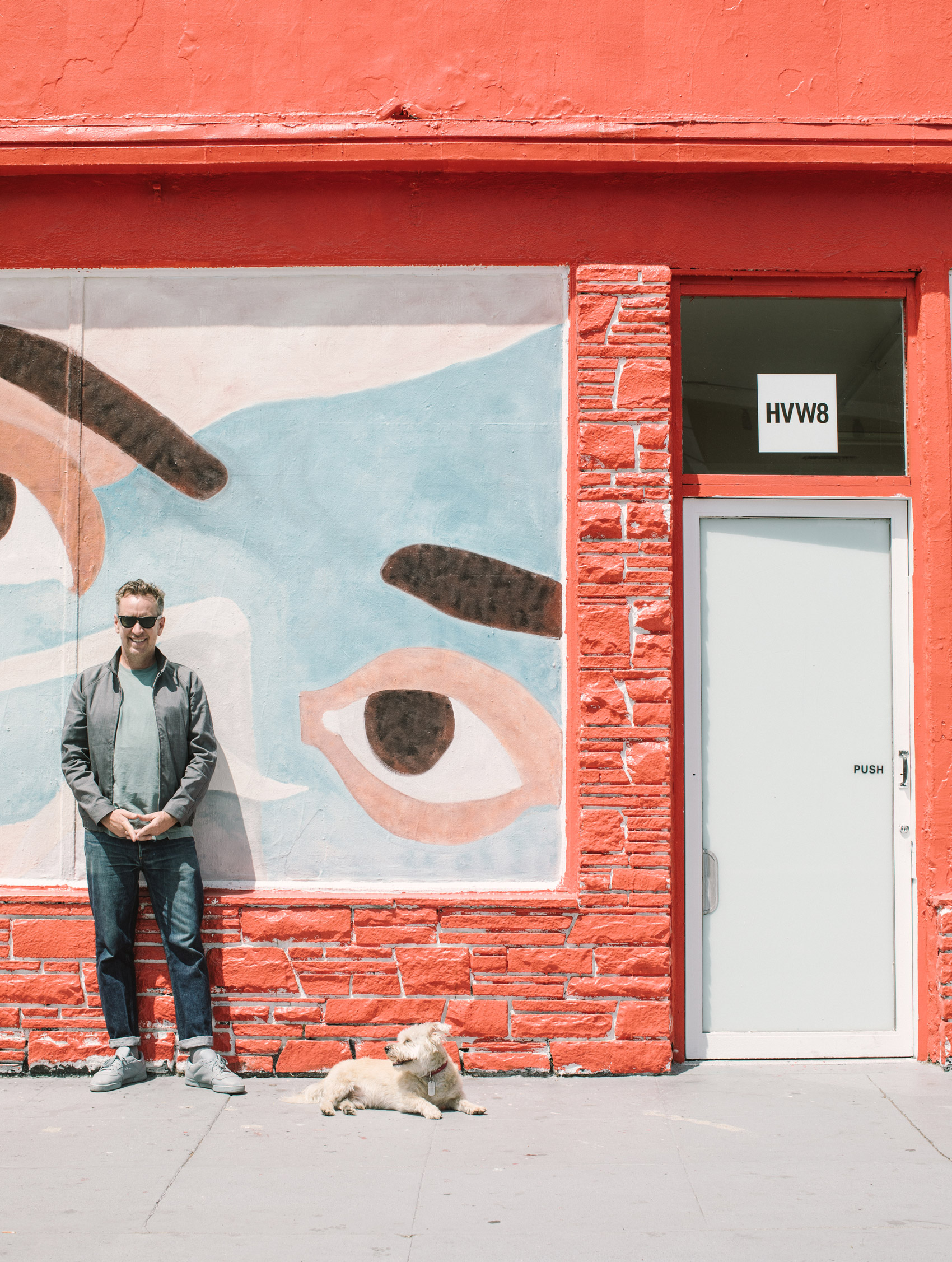 A photo of Tyler Gibney standing in front of his gallery HVW8.